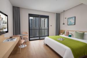 Ένα ή περισσότερα κρεβάτια σε δωμάτιο στο Adoor Suites Shenzhen +35 φωτογραφίες