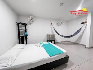 Ένα ή περισσότερα κρεβάτια σε δωμάτιο στο Hotel Playa y Café