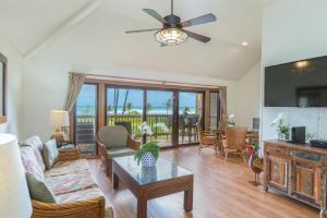 a living room with a couch and a table at Kaha Lani 304 in Lihue