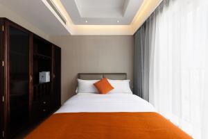 Posteľ alebo postele v izbe v ubytovaní Doria Home International Apartment -Guangzhou Huijin IFC Keyun Road Metro Branch-Canton Fair Free Shuttle