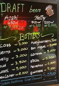 a chalkboard menu of a fast food restaurant at Doobaki Hostel in Gyeongju