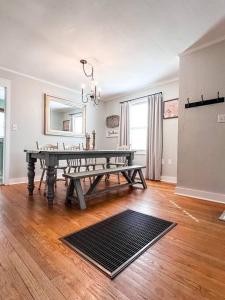 a living room with a ping pong table in it at The Grate House - Fire Table - Grill - Fenced Yard in Searcy