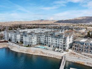 an aerial view of an apartment complex by the water at Exquisite Lakefront Condo in Sparks