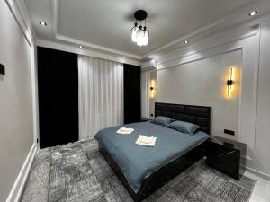 Ένα ή περισσότερα κρεβάτια σε δωμάτιο στο New Apartment near the Savitsky Museum and Central Bazaar