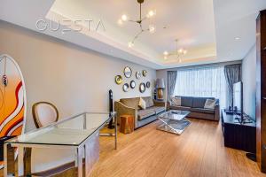 a living room with a couch and a table at Elite Residence, Dubai Marina in Dubai