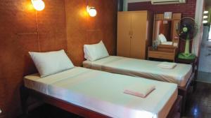 Postel nebo postele na pokoji v ubytování Ben Guesthouse