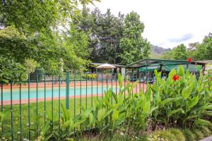 a park with a tennis court and a playground at Silver Birches Holiday Village - Unit 3 in Bright