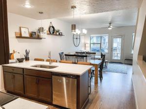 a kitchen and dining room with a table and a dining room at Mac's Vacay Getaway in McCall