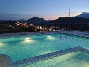 a large swimming pool on the roof of a building at RJ Studio 1 - Kompleks Mutiara in Gua Musang