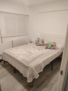 En eller flere senge i et værelse på Apartamento Shoping Center