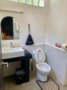 a bathroom with a sink and a toilet and a mirror at 17Stories 1 in Pai +67 photos
