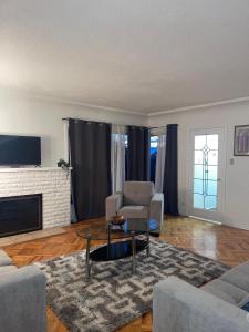 a living room with a couch and a chair at Home in West Vancouver in West Vancouver