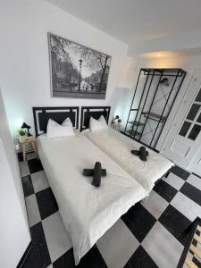 a bedroom with two beds with crosses on them at Prachtig 4/10 pers. Appartement Mijas/Fuengirola in Málaga