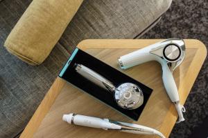 a fountain pen and a watch on a wooden table at Hotel Vista Osaka Namba in Osaka