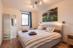Postel nebo postele na pokoji v ubytování NEW - De sheeper - 10Personen - 5slaapkamers - Sauna - Jacuzzi