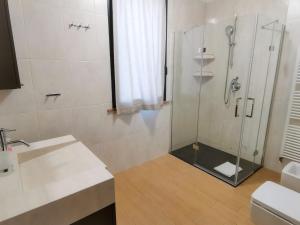 a bathroom with a shower and a sink at B&B Ca' Restom in Reggio Emilia
