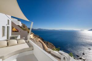 a view of the ocean from the balcony of a house at SEACREST VILLA-VOLCANO VIEW in Oia