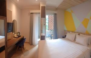 Tempat tidur dalam kamar di Key Inn Hotel Bogor