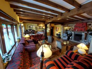 a large living room with couches and a fireplace at Señorio De Altamira - Adults Only in Santillana del Mar
