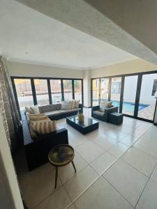 a large living room with a view of the ocean at Bluewave Lifestyle Villa in Hartbeespoort
