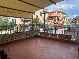 a balcony with a fence with plants on it at Alloggio Turistico Casa Mafalda in Rome