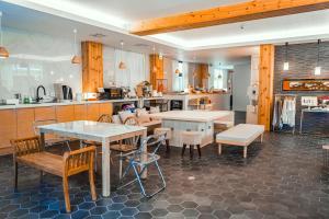 a large kitchen with tables and chairs in a room at Hotel Imagine Kyoto in Kyoto