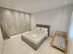 Postel nebo postele na pokoji v ubytování NAVSIKA LUXURY APARTMENT