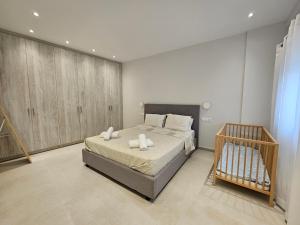 Postel nebo postele na pokoji v ubytování NAVSIKA LUXURY APARTMENT