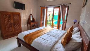 Postel nebo postele na pokoji v ubytování Grace Paradise Guest House