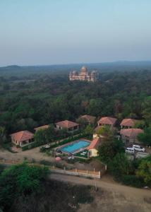 an aerial view of a house with a swimming pool at Vijay Vilas Heritage Resort in Lāeja