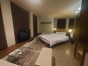 Letto o letti in una camera di Hotel Forest