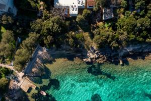 an aerial view of a beach with turquoise water at Seafront House on Island Korčula in Korčula