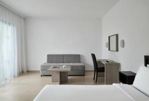 a living room with a couch and a table at Atlantica Callisto in Ayia Napa +36 photos