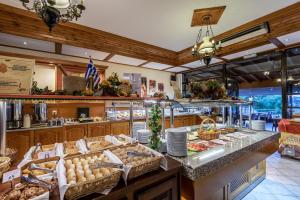 a buffet in a restaurant with a lot of food at Palladium hotel in Marmari