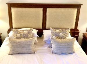 A bed or beds in a room at Capannelle Wine Resort