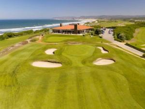 an overhead view of a golf course with the ocean at Hotel Contriz in Póvoa de Varzim