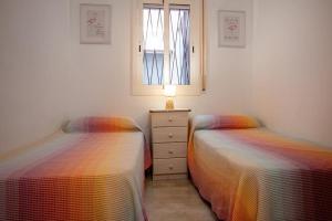 Postel nebo postele na pokoji v ubytování AT301 Apartamento a pocos metros de la playa de Altafulla