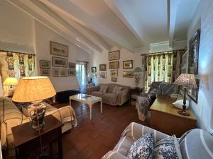 a large living room with couches and a table at VILLA ALBATROS in Fornells