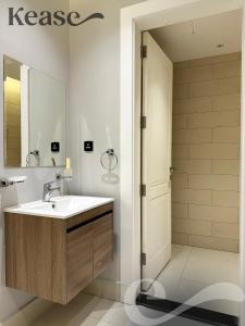 a bathroom with a sink and a mirror at Kease Tawun B3-11 Royal touch Balcony AZ24 in Riyadh