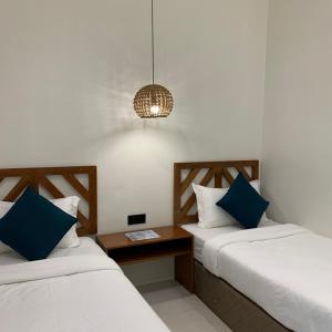 Postel nebo postele na pokoji v ubytování Bahandi Hotel