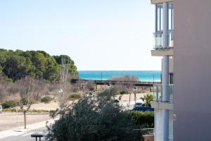 a view of the ocean from a building at Hauzify I Apartament Oliveres in Hospitalet de l'Infant