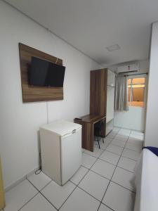 TV a/nebo společenská místnost v ubytování PORTAL PARQUE HOTEL