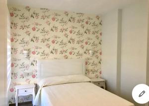 A bed or beds in a room at AT SAN MIGUEL o