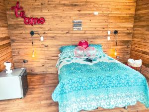 a bedroom with a bed with two spheres on it at La Chagra VIP in Villavicencio