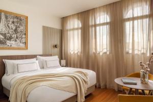 Un ou plusieurs lits dans un hébergement de l'établissement Casa de las Artes, member of Meliá Collection