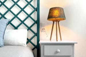 Cama ou camas em um quarto em Apartamentos Vela Blanca