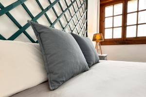 Cama ou camas em um quarto em Apartamentos Vela Blanca