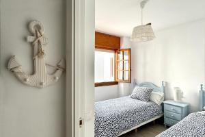 Cama ou camas em um quarto em Apartamentos Vela Blanca