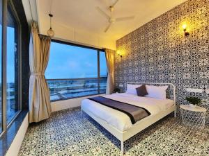 Een bed of bedden in een kamer bij StayVille- Casa Aruba