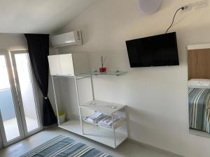 TV a/nebo společenská místnost v ubytování Hotel Rosa